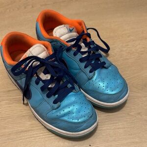 Boys Nike dunks. Iridescent blue, glow in dark sole. Could use new laces :)